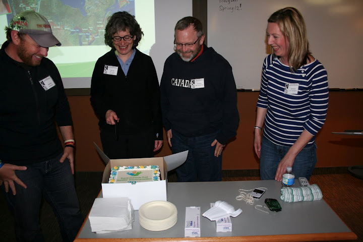 Dana Meise (the Great Hike), Ruth Marr (TCT board), David King (MRTA president), and Jane Murphy (TCT) prepare to enjoy a cake celebrating the Trans Canada Trail's 20th anniversary. Photo: Ian Hughes, MRTA