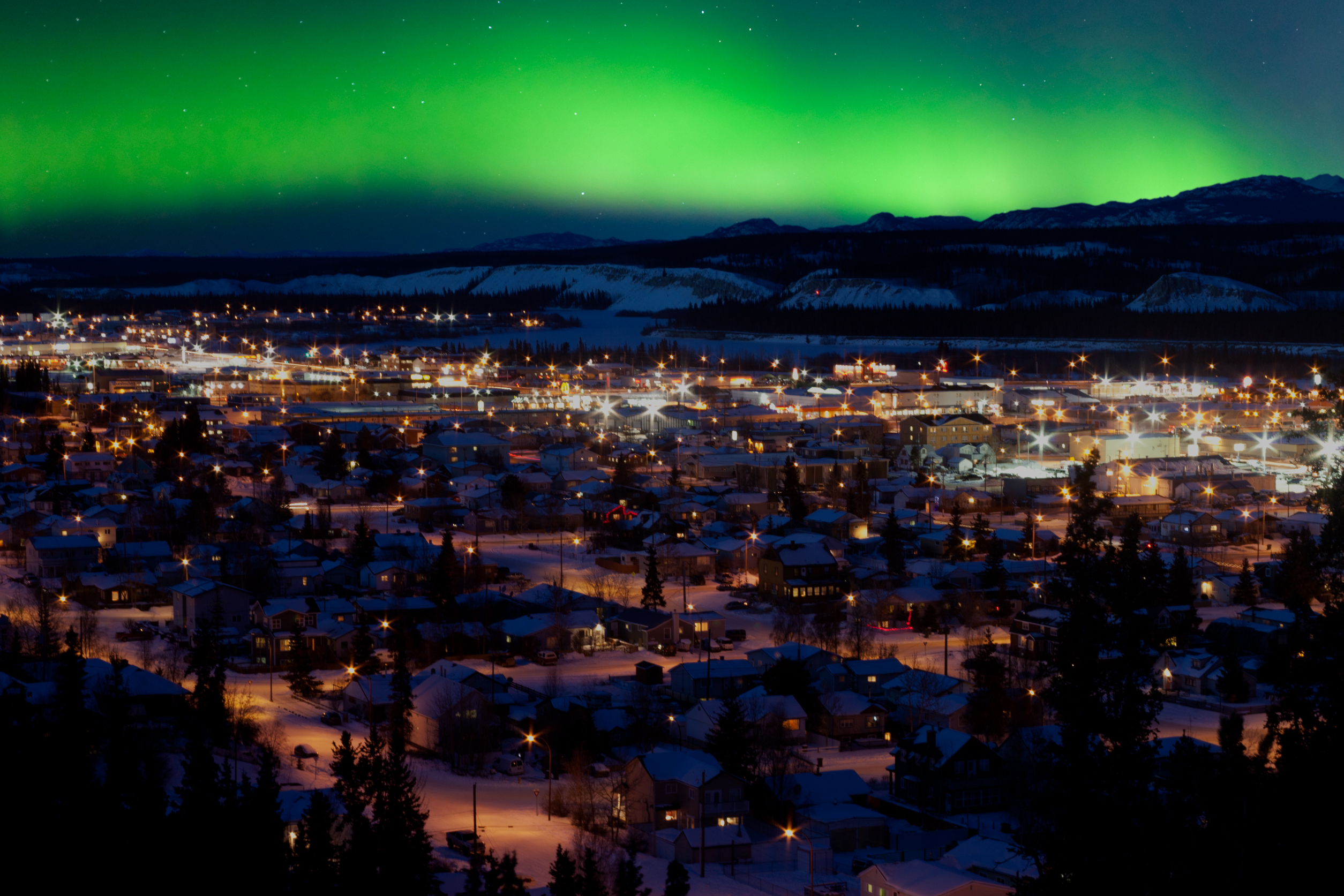 The northern lights dance over the Whitehorse skyline