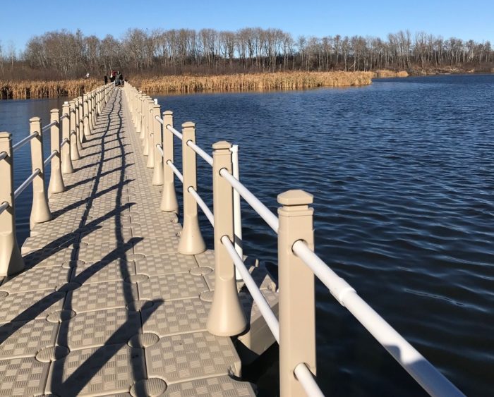 A repaired boardwalk passes over a beautiful wetland in Yorkton, Saskatchewan.