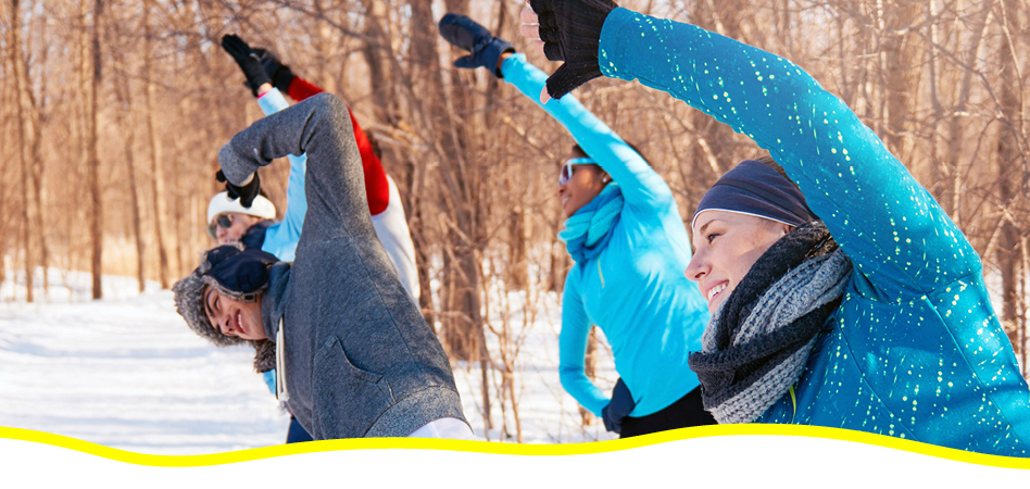 Group of people exercising outside during the winter to boost mental well-being.