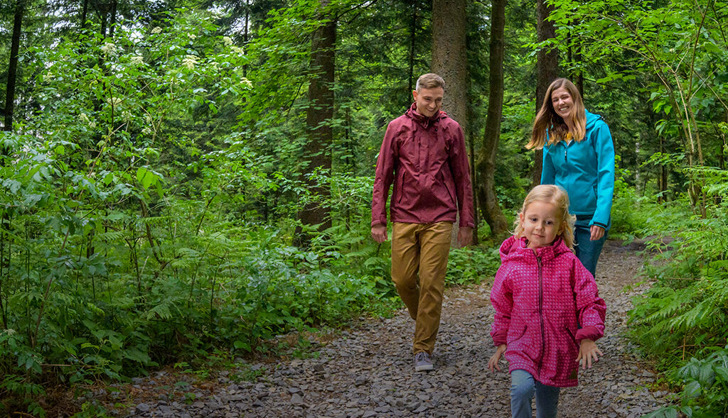 A young family walks the trail