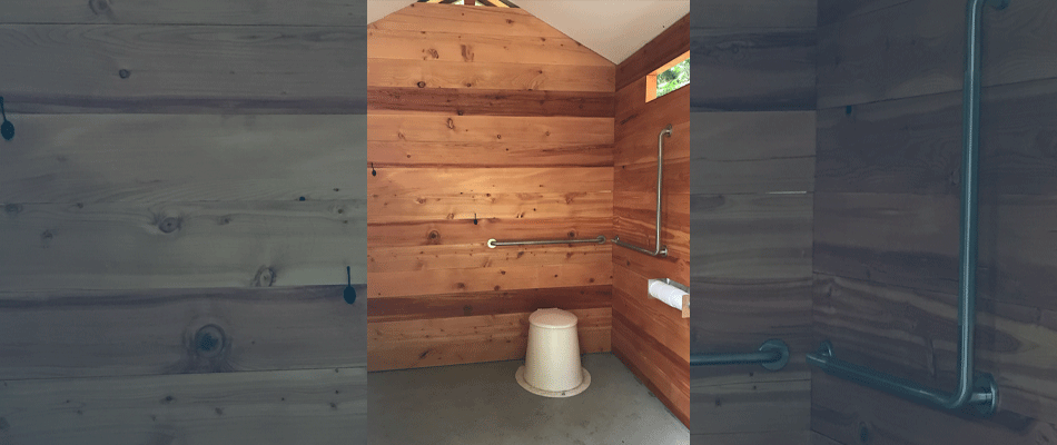 The interior of an accessible outhouse