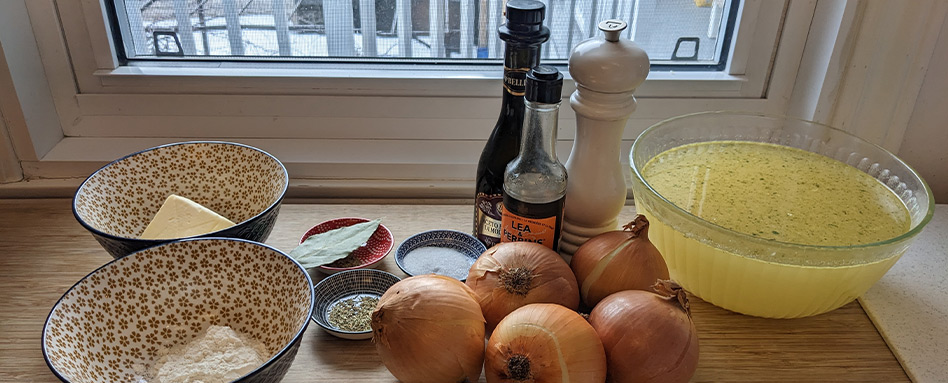 Healthy meal prep - crockpot recipes: three bowls, onions and seasoning on a kitchen counter. 