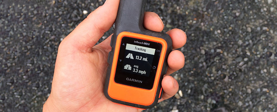 Bonnie holding a Garmin inReach device