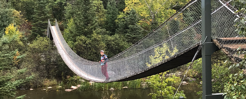 Bonnie standing on a bridge