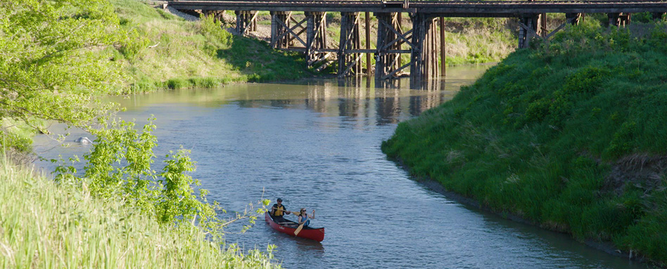 Two adults in a canoe on the Lumsden SK water trail
