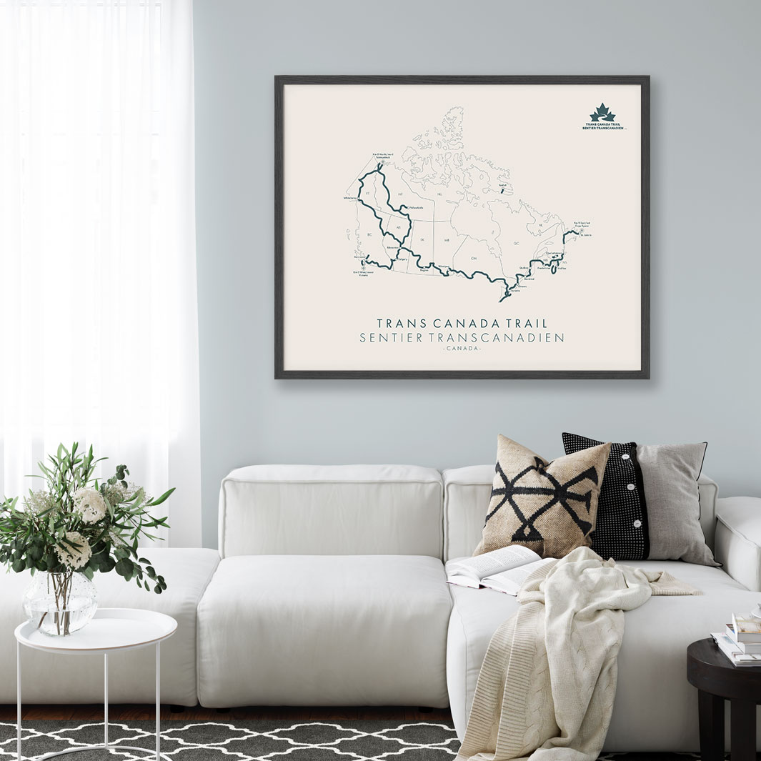 Tell Your Trail map hanging on a living room wall