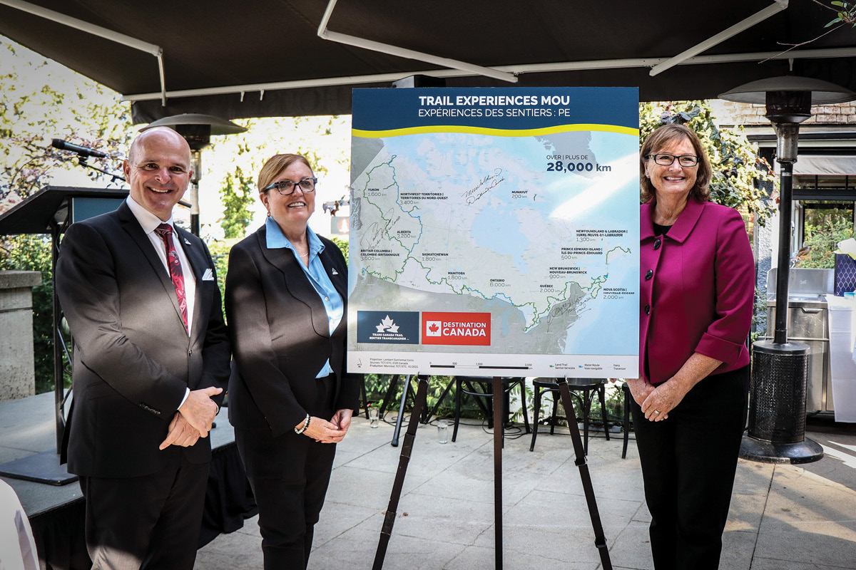 Eleanor McMahon, President & CEO of Trans Canada Trail and memebrs of the Ontario’s Waterfront Regeneration Trust Corporation standing in front of a Trans Canada Trail sign