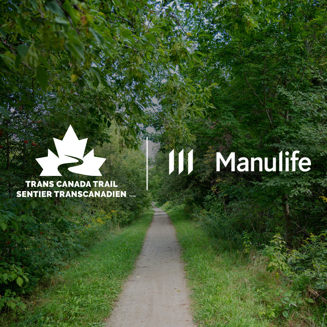 Manulife logo and Trans Canada Trail sign on scenic trail background.