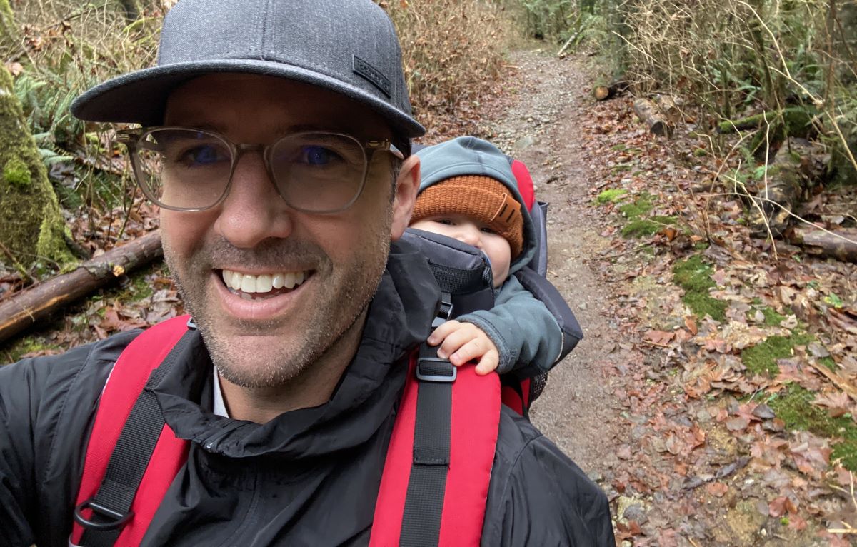 Matt DeCourcey on the trail with his son in a backpack-style carrier.