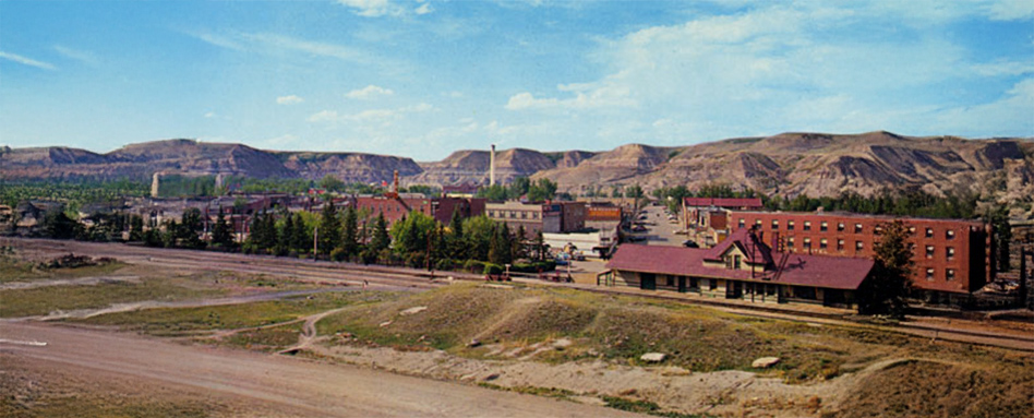 photo of mountainous town with blue sky