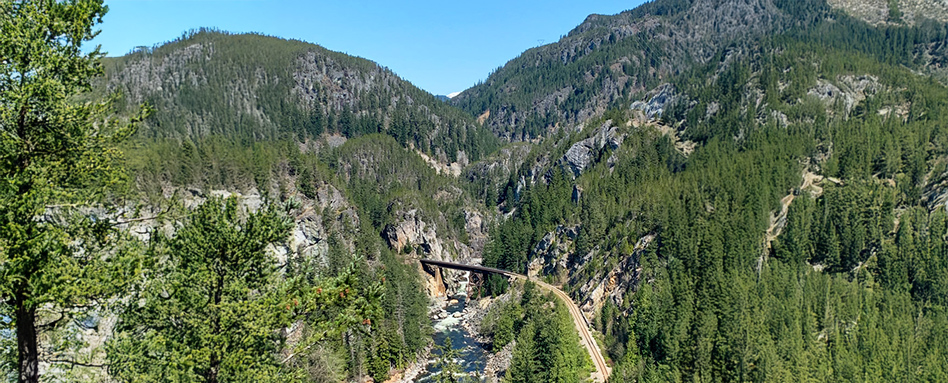 birds-eye view of biking trail in mountains