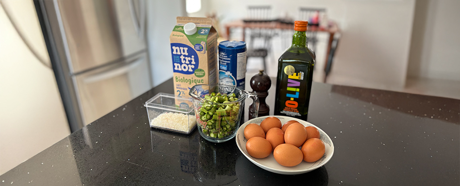 eggs, olive oil, asparagus, seasonings on table