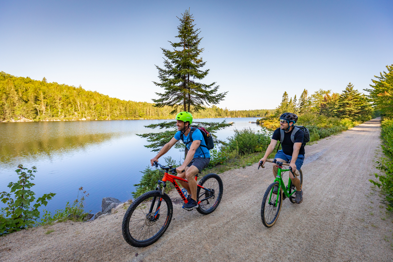 Two people riding their bikes on the Rum Runners Trail in Nova Scotia