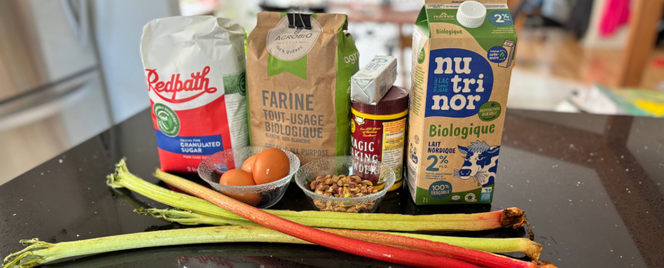 flower, baking powder, eggs and rhubarb on a table