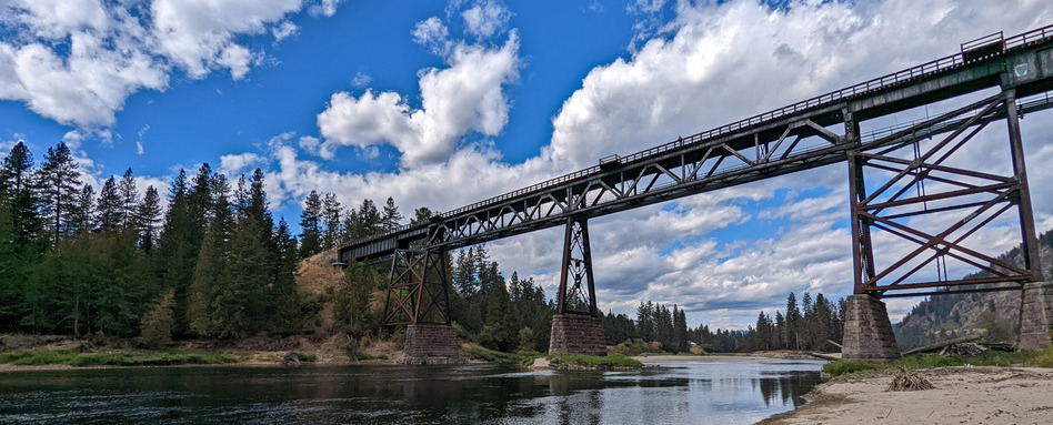 long bridge over water and blue sky