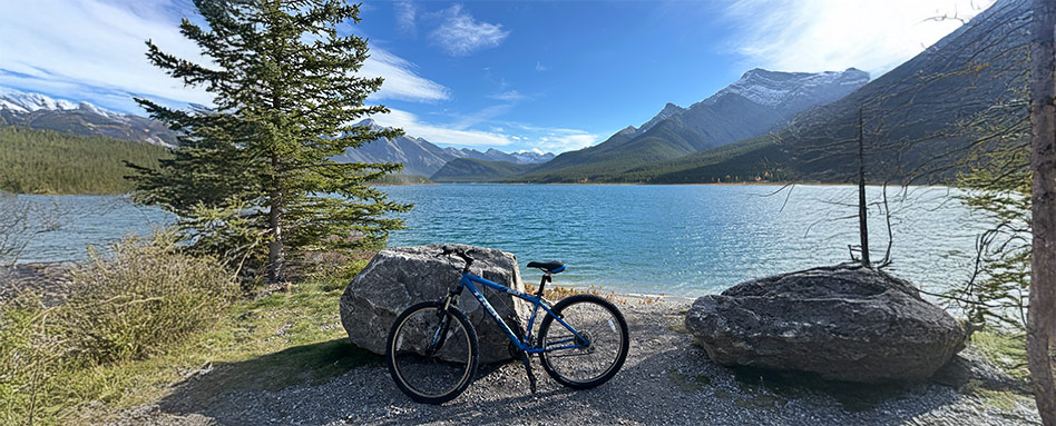 bicycle infront of a lake and mountain