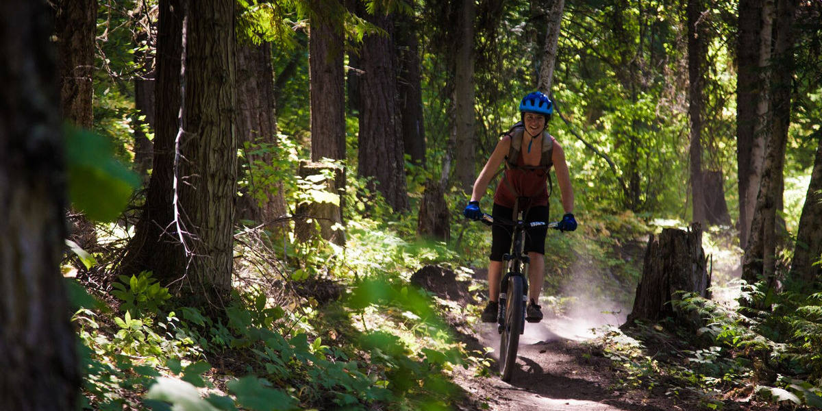 woman on a bike on a trail