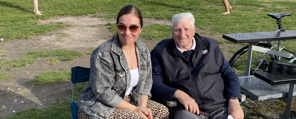two people smiling looking at a camera