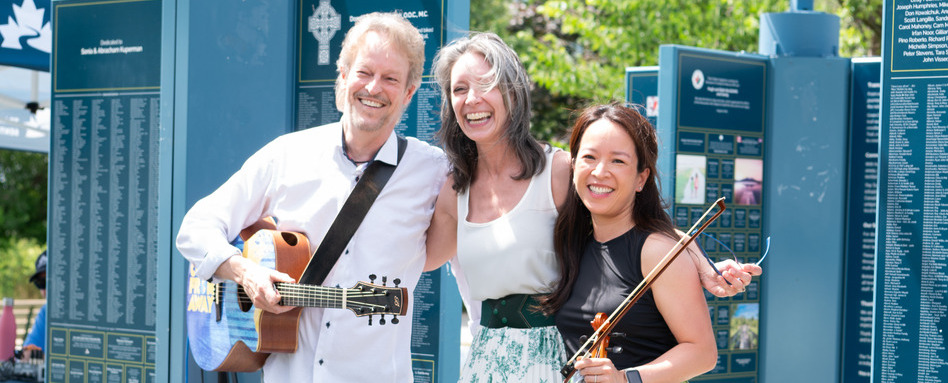 group of people holding instruments smiling 