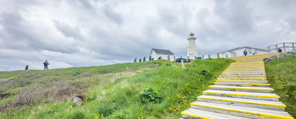 long trail with lighthouse on a cloudy day