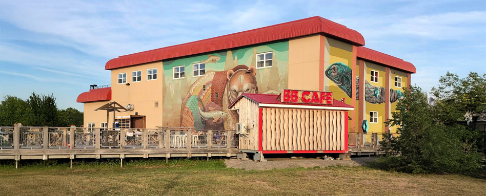 building with painting of wildlife in a field