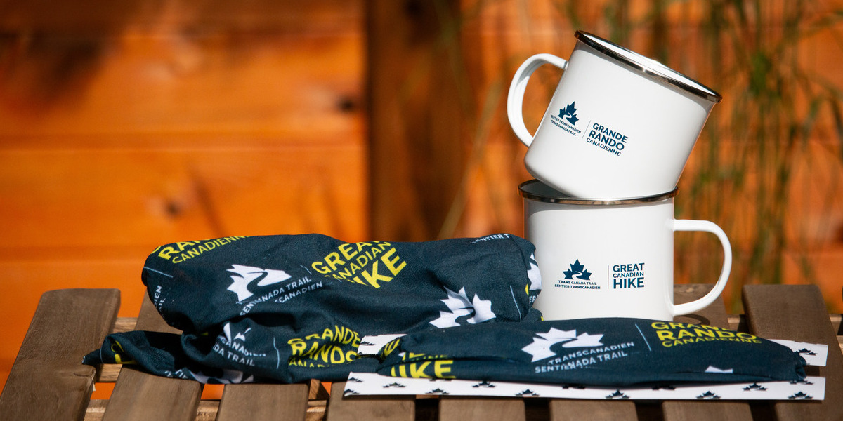 mugs and tshirts displayed on a table