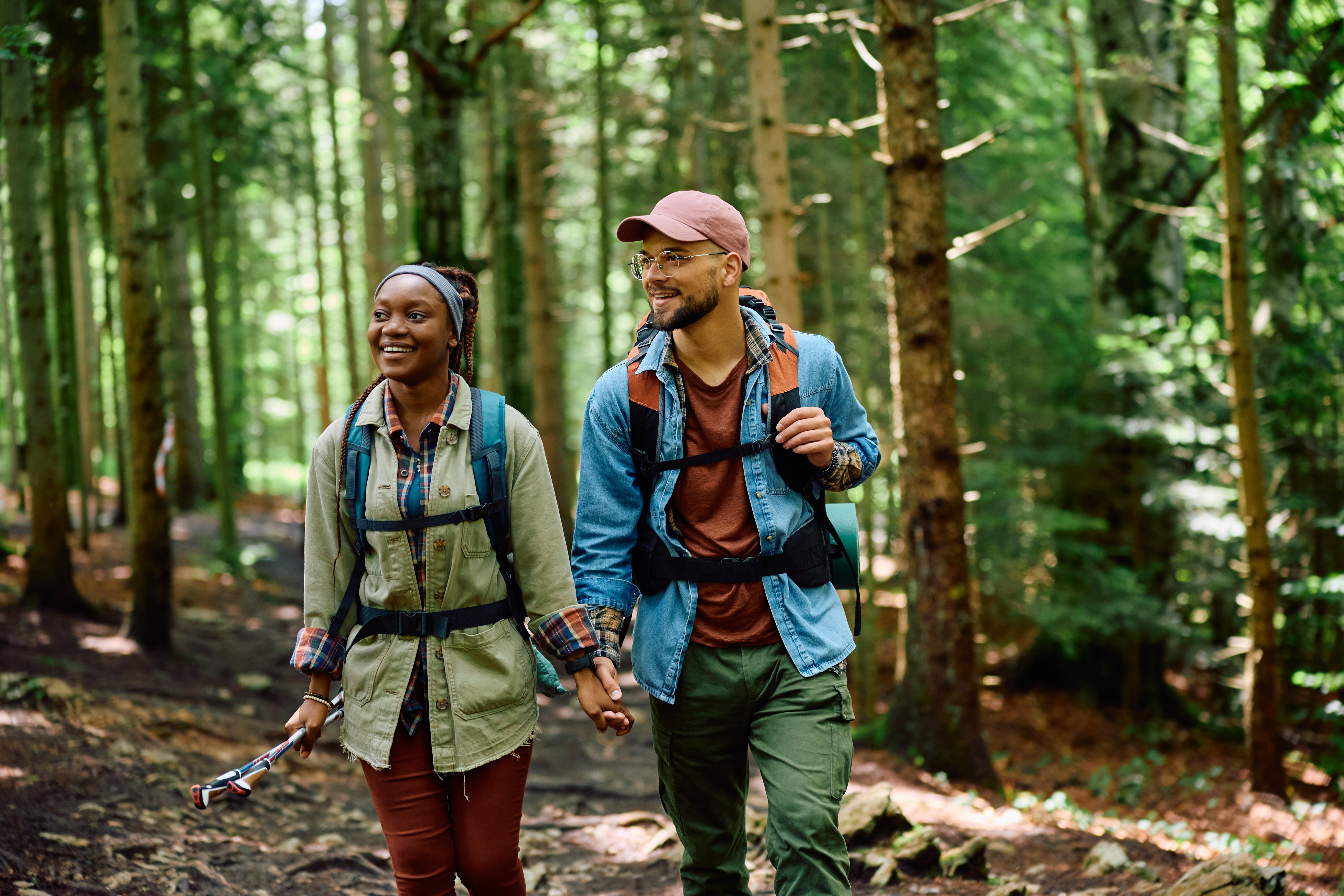 Two people hiking in the forest.