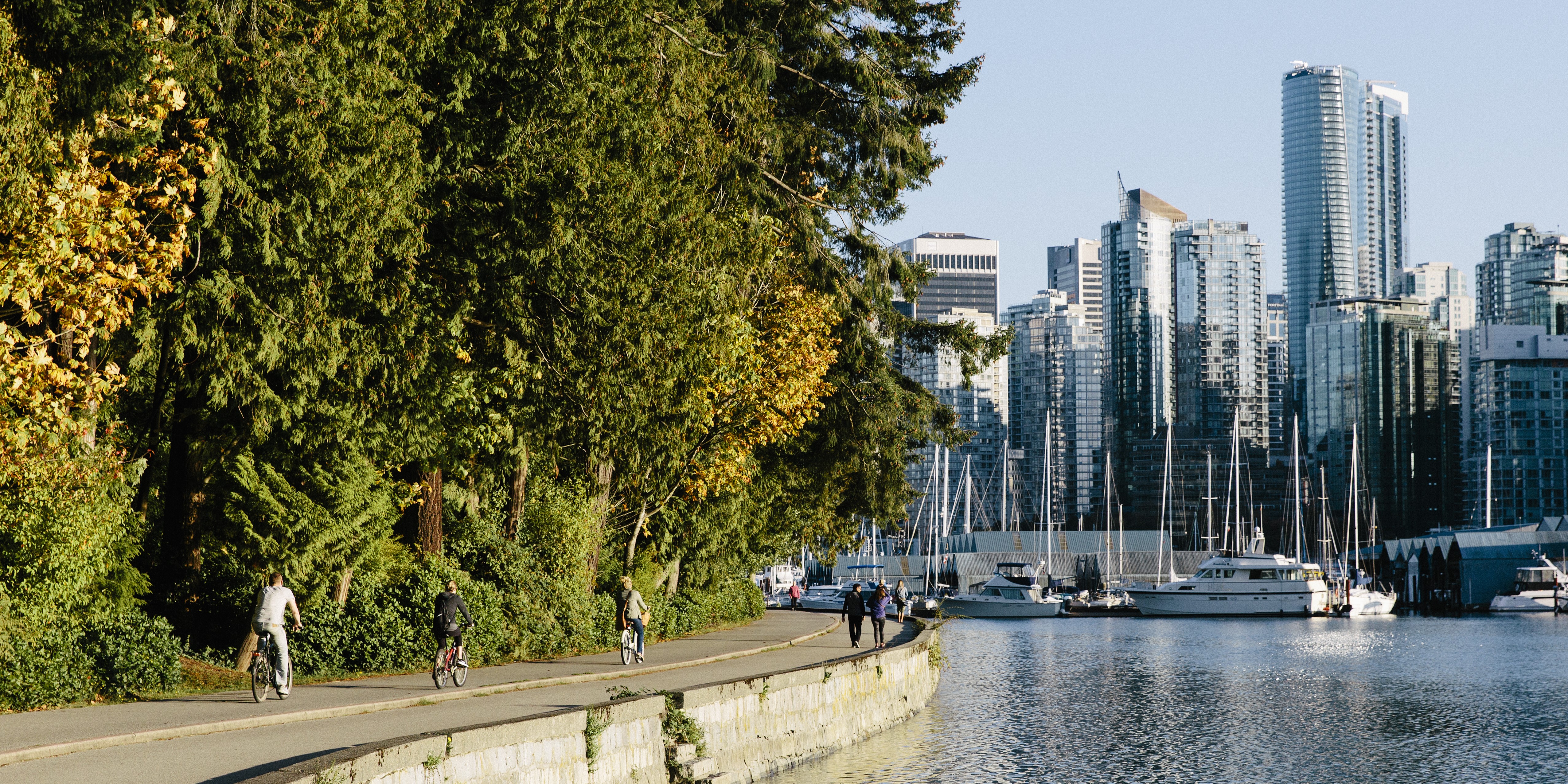 Cyclists and pedestrians riding around Stanley Park in Vancouver | Trans Canada Trail Cyclists and pedestrians riding around Stanley Park in Vancouver.