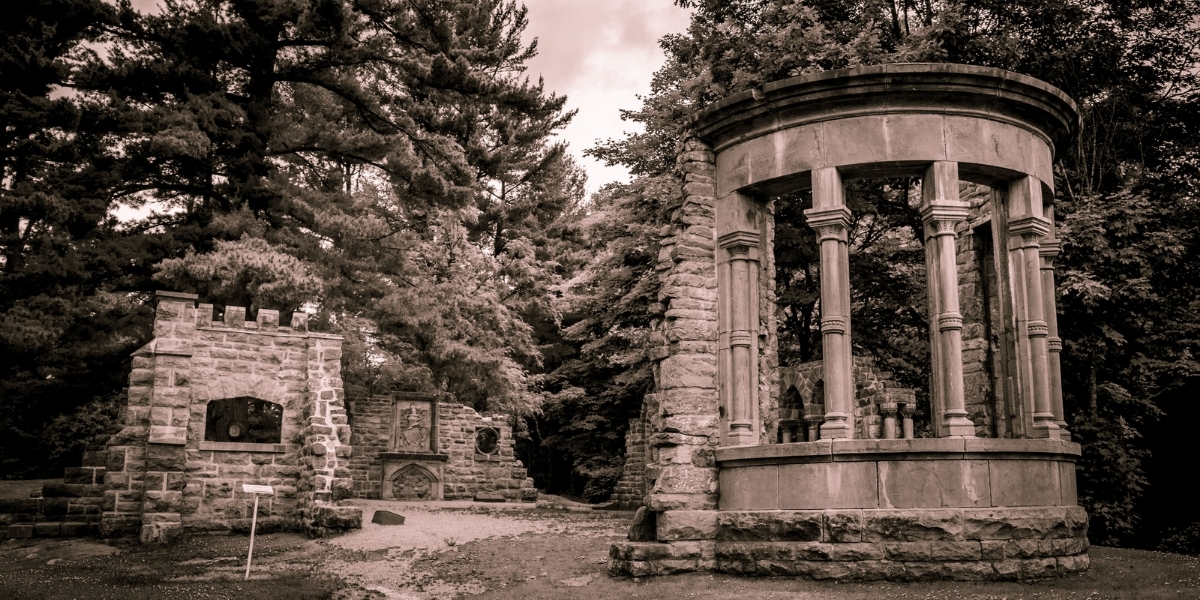 Feature_Spooky Stories_The_Abbey_credit Shawn Kent | Trans Canada Trail black and white photo of cylander structure in a forest