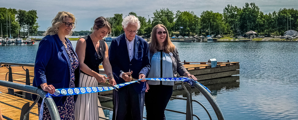 SF107571_ON_Floating-Boardwalk-at-Bell-Park-6553_Web_StorySupport_Images_948x383 | Trans Canada Trail people smiling on boardwalk while cutting a rope