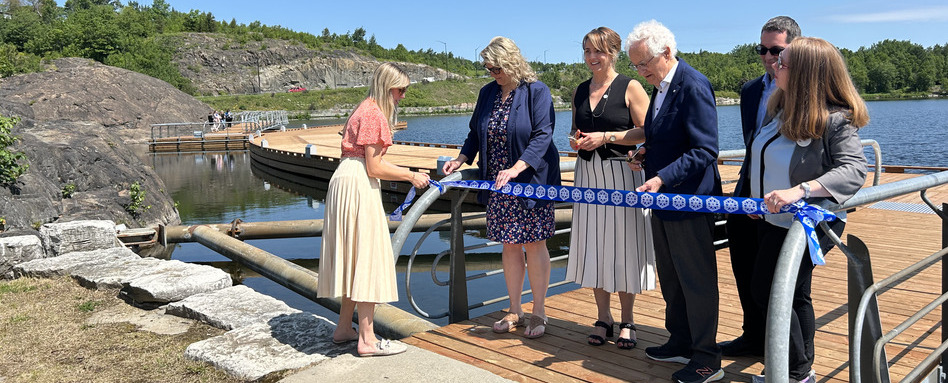 SF107571_ON_Floating-Boardwalk-at-Bell-Park-8158_Web_StorySupport_Images_948x383 | Trans Canada Trail people cutting a rope on a boardwalk on sunny day