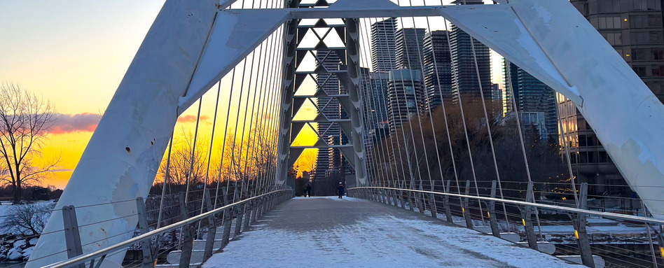 bridge covered in snow at sunset