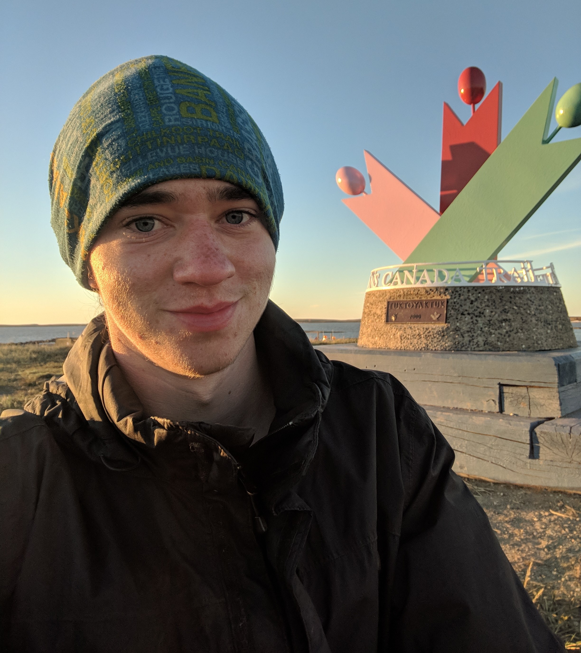 Aidan Beckett at the Trans Canada Trail's Arctic KM Zero in Tuktoyaktuk, NWT.