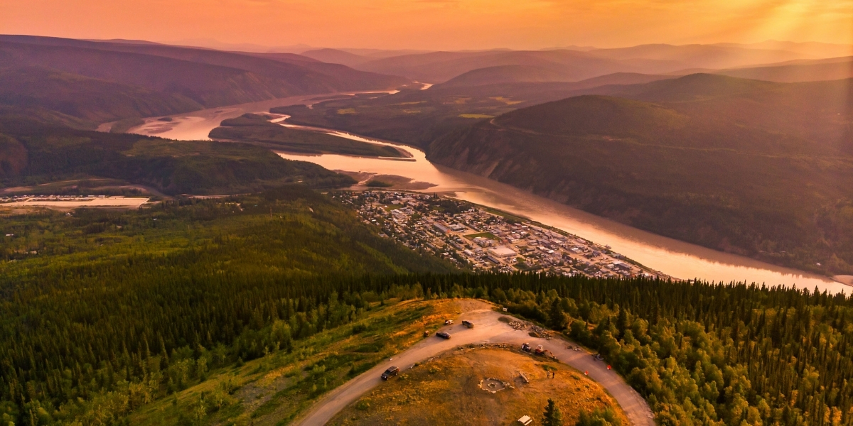 sunset over a valley and mountains