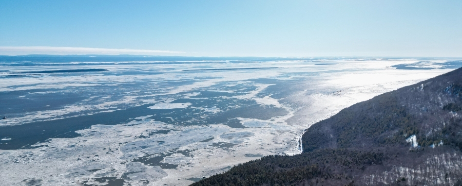 birds eye of large frozen lake