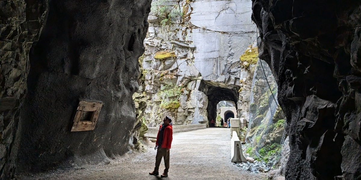 00Feature image_BC_Othello Tunnels_credit Gemma Taylor - Off Track Travel | Trans Canada Trail woman looking up at rock tunnels