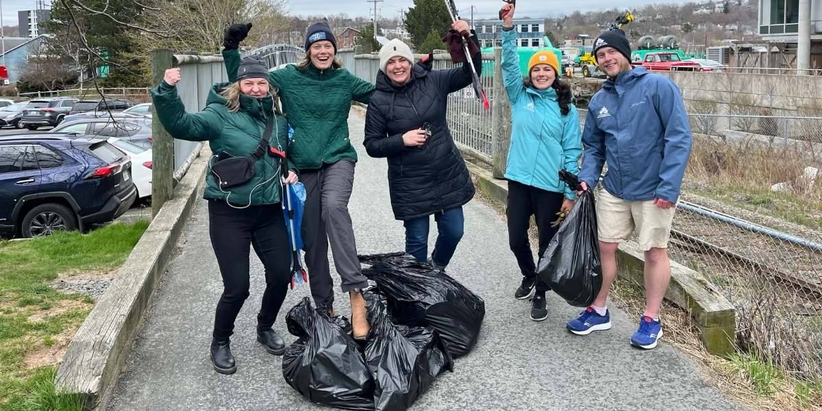 00Feature story_Toyota Employee Engagement_credit Trans Canada Trail staff | Trans Canada Trail group of people picking up garbage on a cloudy day