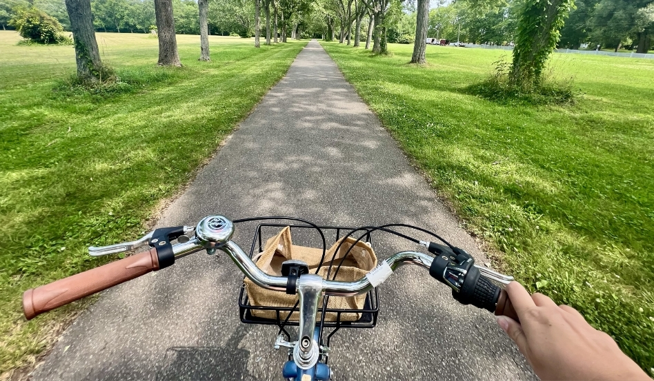 02Support image_ON_Bri Mitchell biking in ON_Niagara River Recreational Trail_credit Bri Mitchell cannot reuse | Trans Canada Trail POV of someone riding bike on paved trail on a sunny day