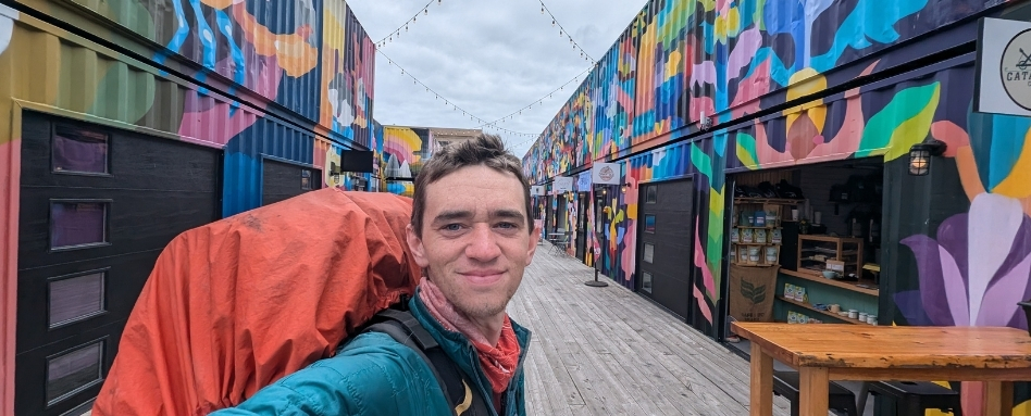 01Support image_Aidan Beckett St Johns - credit Aidan Beckett | Trans Canada Trail selfie of a person in a marketplace