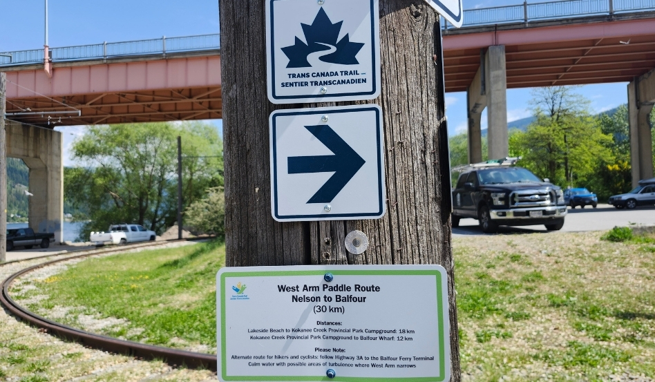 01Support image_Ali Becker web story_West Arm Paddle Route_credit Ali Becker | Trans Canada Trail trail signage in parking lot on sunny day