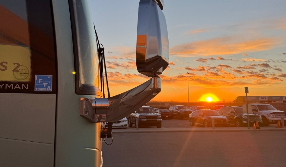 02Support image_Sarah Shandl_credit Sarah Shandl | Trans Canada Trail tour van mirror at sunrise in parking lot